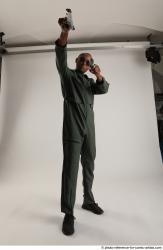 ERIC STANDING POSE WITH GUNS